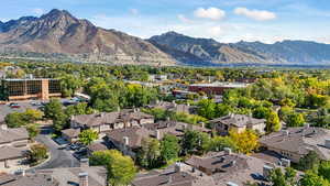 Aerial perspective of suburban area with a mountainous background