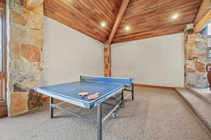 Game room with light carpet, recessed lighting, high vaulted ceiling, and wood ceiling