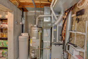Utility room with strapped water heater and heating unit