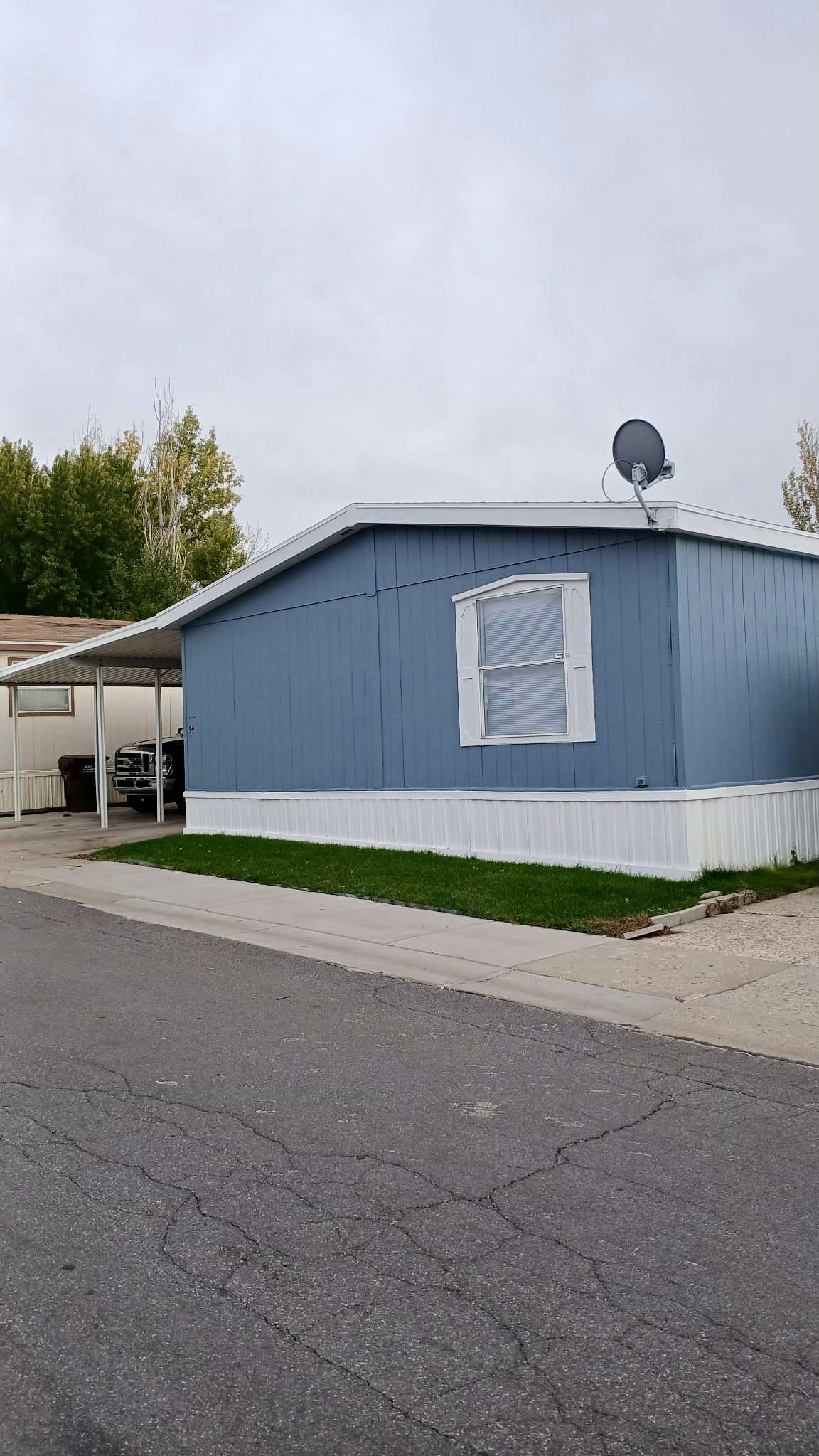 View of side of property with a carport