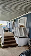 Entrance to property featuring a deck