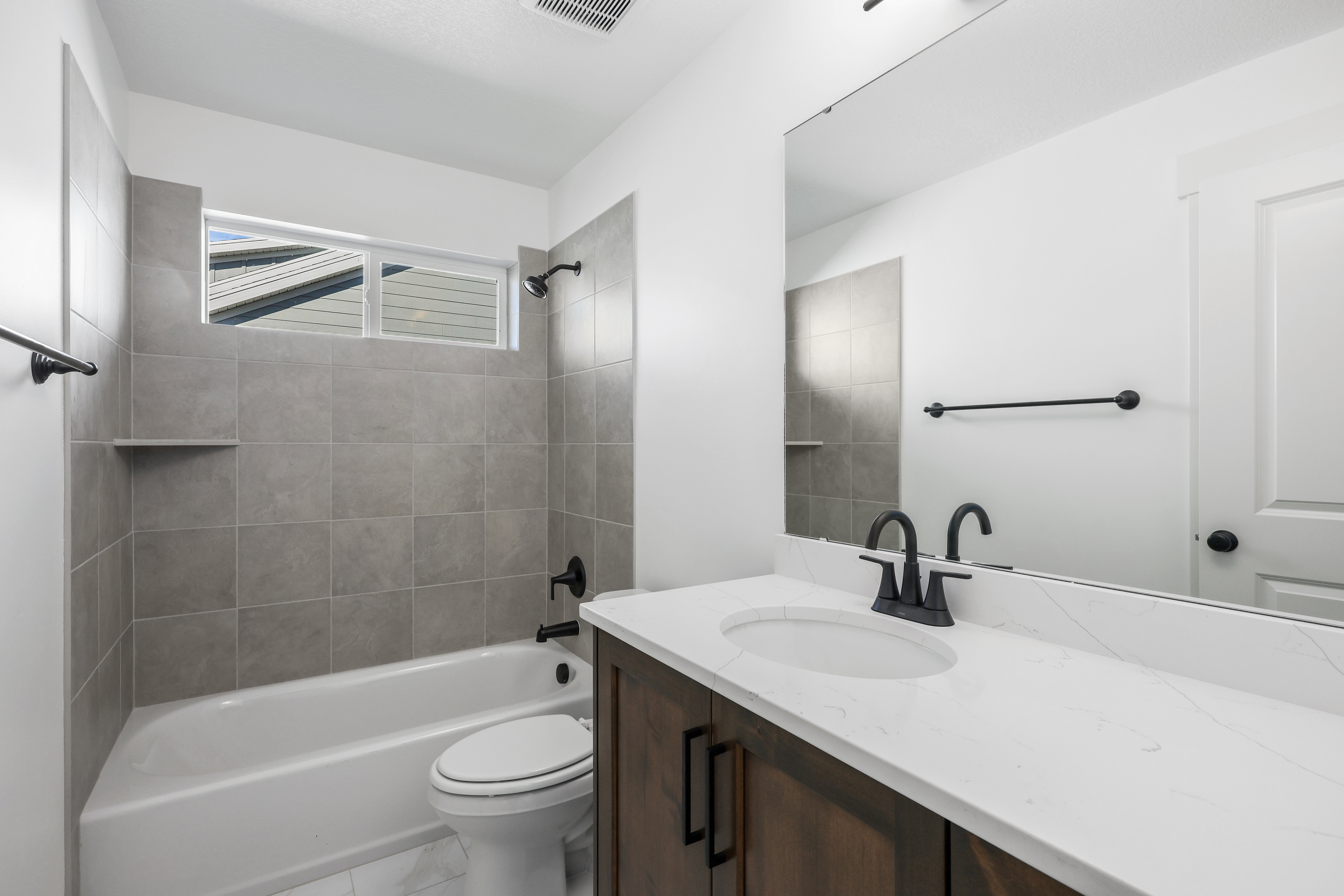 Full bathroom with tub / shower combination and vanity