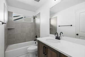 Full bathroom with tub / shower combination and vanity