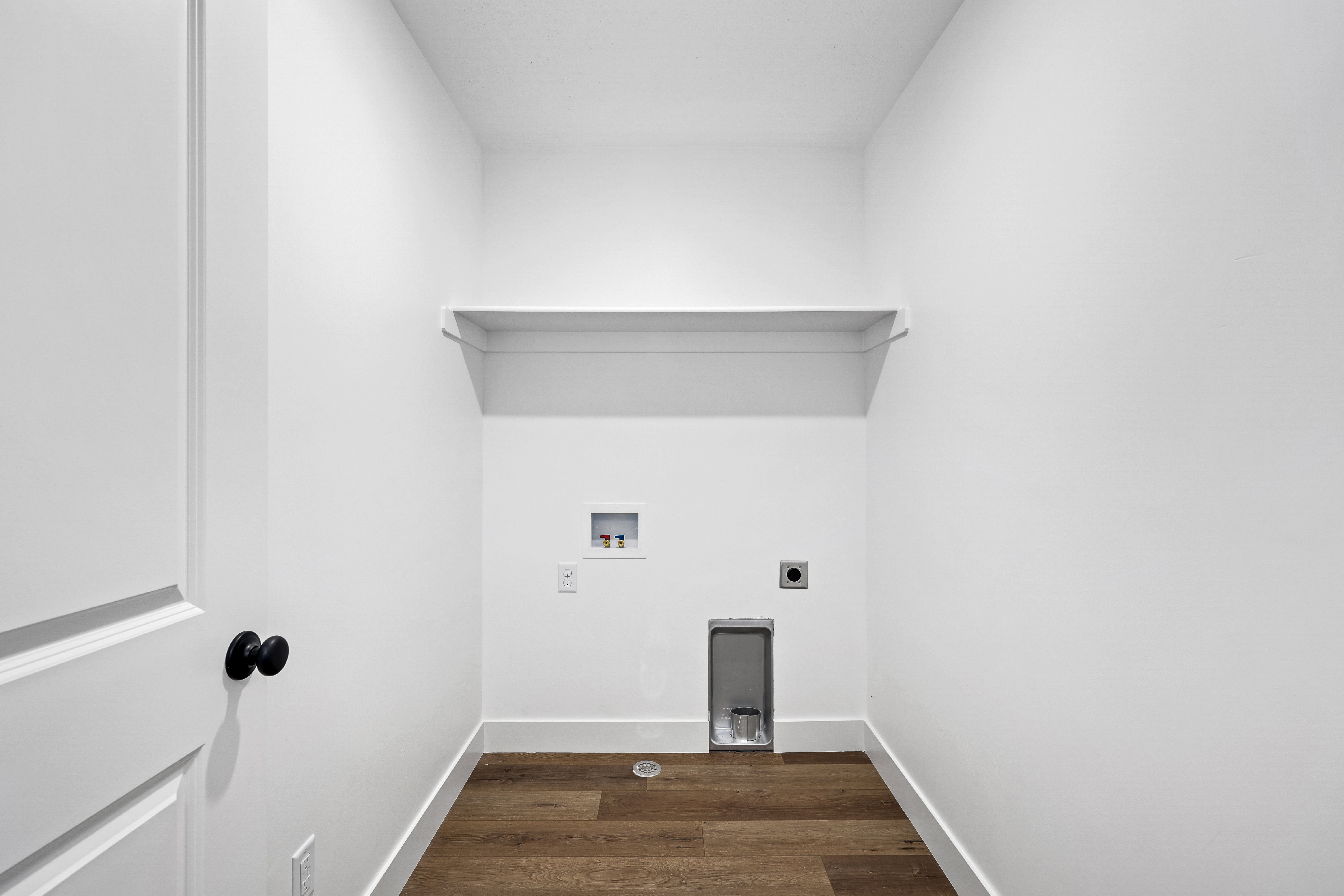 Washroom with dark wood-style flooring, electric dryer hookup, and washer hookup