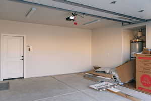 Garage featuring water heater