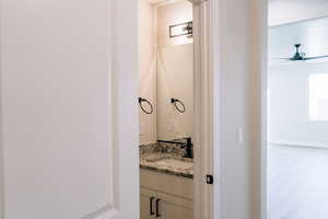 Bathroom with vanity and a ceiling fan