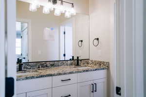 Full bathroom featuring double vanity