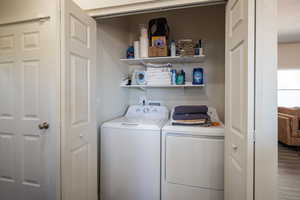 Washroom featuring washer and clothes dryer
