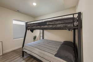 Bedroom featuring wood finished floors and recessed lighting