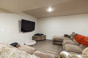 Living room with wood finished floors and baseboards