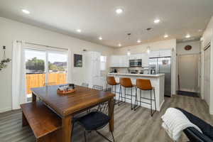 Dining area featuring recessed lighting and light wood-style flooring