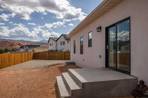 Fenced backyard featuring a patio and a mountain view