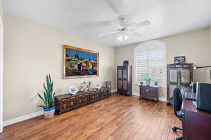 Office space featuring wood finished floors and ceiling fan