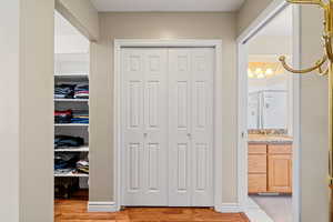 Hallway with light wood-type flooring