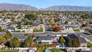 Aerial perspective of suburban area featuring a mountain backdrop
