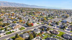 Aerial view of residential area featuring a mountain backdrop