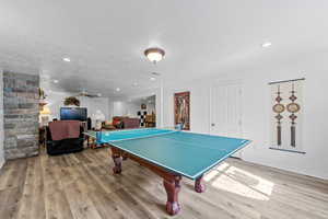 Playroom featuring ceiling fan, light wood-style floors, recessed lighting, and a textured ceiling