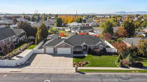 Aerial view of residential area featuring a mountainous background
