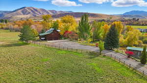 View of mountain backdrop featuring rural landscape