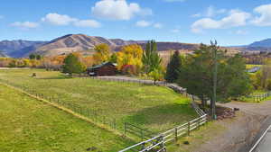 View of mountain background with rural landscape and agricultural land