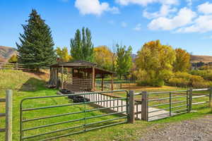 Horse barn featuring a mountain view