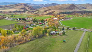 Aerial overview of property's location with mountains and rural landscape