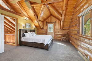 Bedroom with rustic walls, a baseboard radiator, carpet floors, wooden ceiling, and ceiling fan