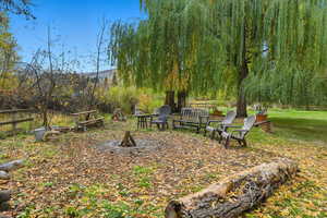 View of yard featuring an outdoor fire pit