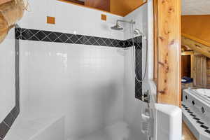 Full bathroom with tiled shower
