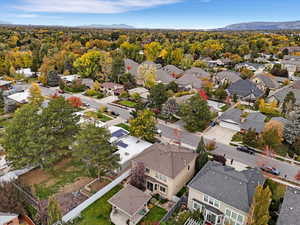 Aerial perspective of suburban area with a mountainous background