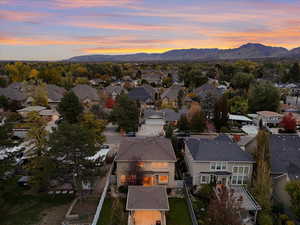 Aerial view of residential area featuring a mountainous background