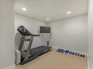Workout area with carpet and recessed lighting