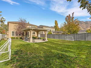 Fenced backyard featuring a patio