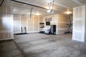 Garage featuring a garage door opener