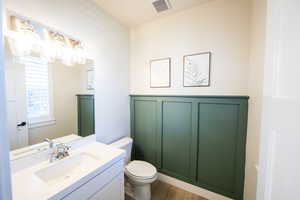 Bathroom with vanity and light wood-style floors