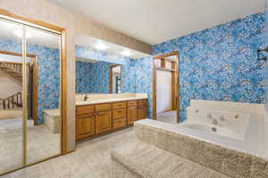 Large soaker tub, 2 closets, and a separate toilet closet.
