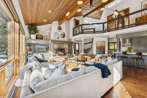 Lobby with recessed lighting, wooden ceiling, high vaulted ceiling, and stairway
