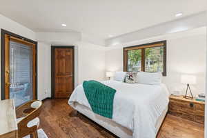 Bedroom with wood finished floors and recessed lighting
