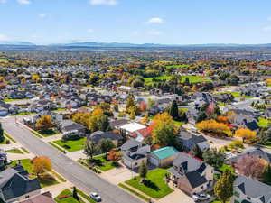 Aerial perspective of suburban area with a mountain backdrop