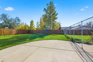 Fenced backyard featuring a patio