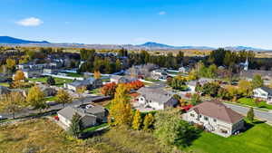 Aerial perspective of suburban area with a mountainous background