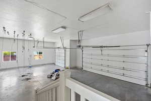 Garage featuring baseboards