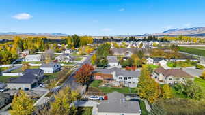 Aerial perspective of suburban area featuring a mountainous background