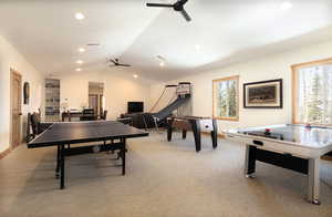 Recreation room featuring vaulted ceiling, light carpet, a ceiling fan, and recessed lighting