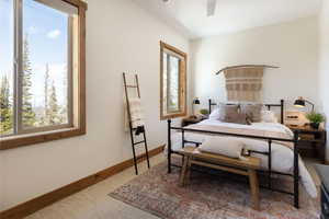 Bedroom featuring baseboards and ceiling fan