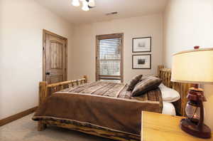 Bedroom featuring a textured ceiling and a ceiling fan