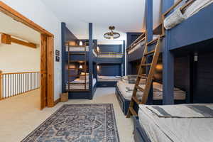 Bedroom featuring light colored carpet