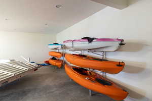 Interior space with a textured ceiling and recessed lighting