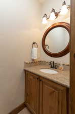 Bathroom with vanity and baseboards