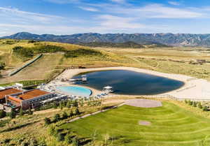Overview of rural landscape with a water and mountain view and a pool area